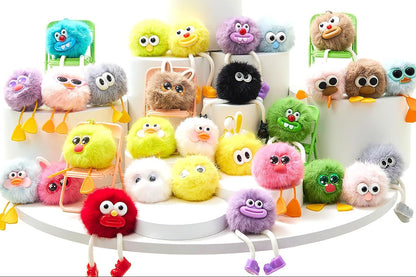A collection of colorful fuzzy monster plush keychains displayed on white risers, with a hand holding three of the plushies in a circular inset and a set of 30 keychains advertised in the top right.