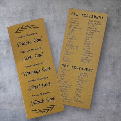 Two prayer bookmarks on a gray background, one titled 'Happy Moments' and the other listing books of the Bible.